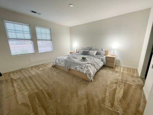 Master bedroom after being cleaned.