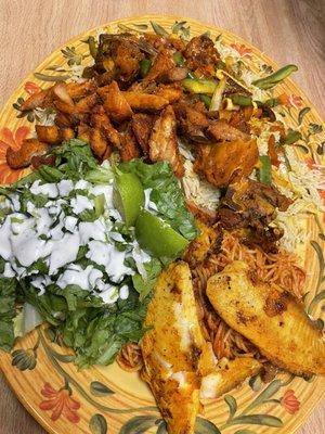 Federation (mix of pasta and rice) with a side of fried  fish and chicken kutelati