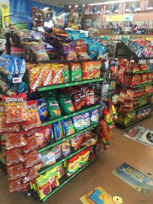 2 different rows of chips and other snacks