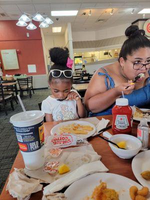 My daughter  in law and granddaughter  enjoying  their meals.