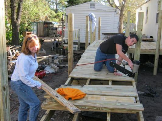 Sean and I in action building this wheelchair ramp for someone in need.