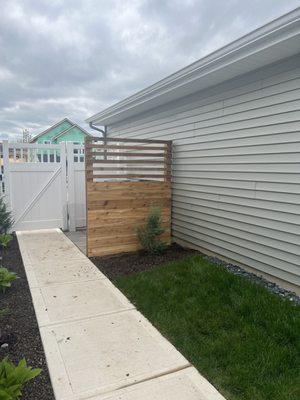 Small fence to hide my trash  recycling bins.