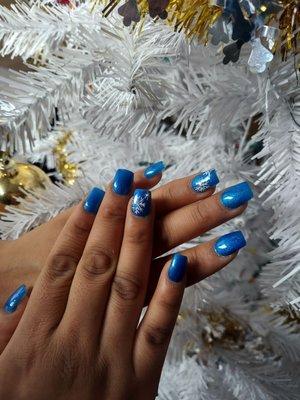 Blue glitter gel nail polish - Acrylic full set. Snowflake designs with 4 rhinestones.