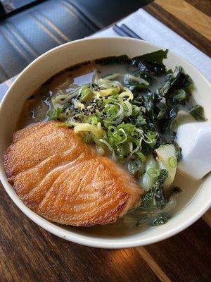 Salmon ramen in a spicy miso broth with scallions, wakame, sautéed bok choy