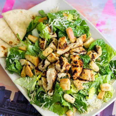 Caesar salad with pita bread, freshly made grilled chicken and croutons