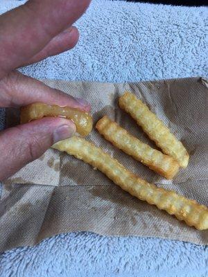 Look at the grease oozing out of the fry. And the grease deposit left after just 3 minutes on napkin.