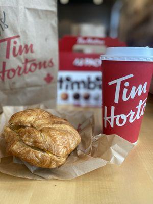 Sausage croissant with a large mocha coffee and Timbits Pack on the side