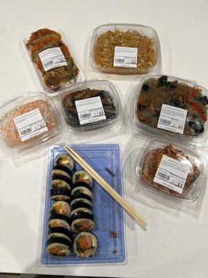 Gimbap, stir fried eggplant and assortment of banchan