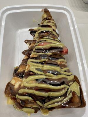 Strawberry banana crêpe with Nutella, dark chocolate and pistachio sauce