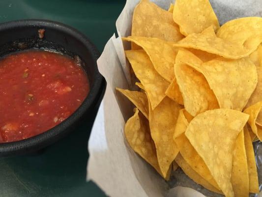 Crispy homemade chips served with traditional salsa.