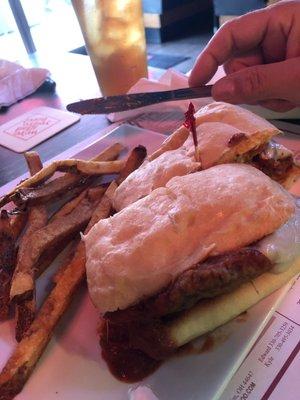 Chicken Parmesan sandwich with 1/2 order fresh cut fries.