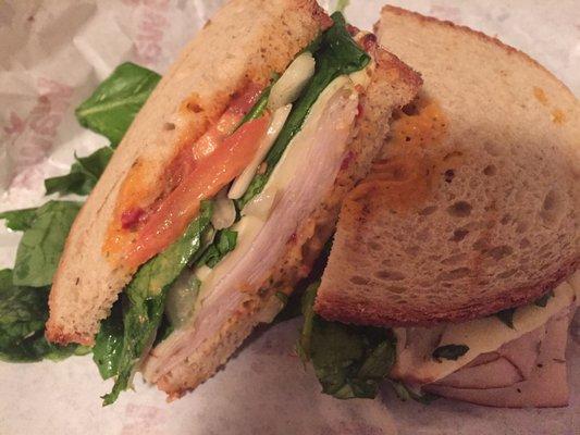 Turkey & American on Rye w/ spinach, onions, tomatoes & tomato pesto spread.