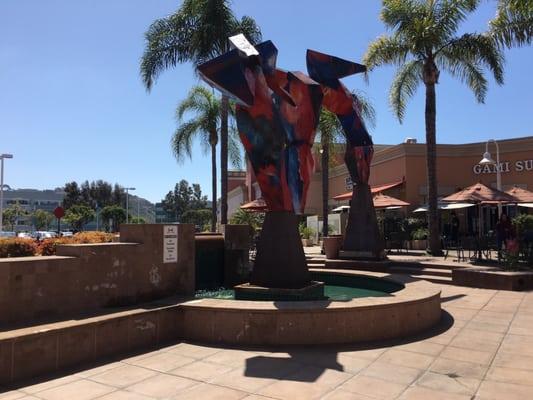 Hanging out by the fountain doing some coding. Plenty of tables with umbrellas.