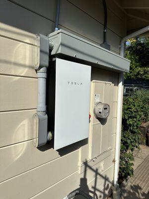 The Tesla Gateway 2 allows for up to 200 amps and is the brain that controls the Tesla Powerwall 3 battery that is shown in other pictures.