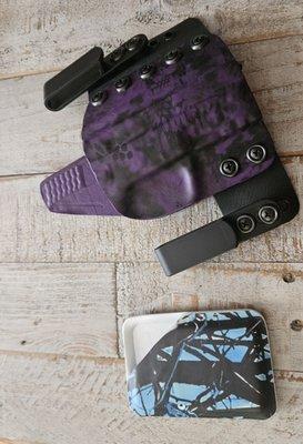 The purple is my gun holster for my Smith and Wesson .22, and the blue card wallet is my husband's gift...