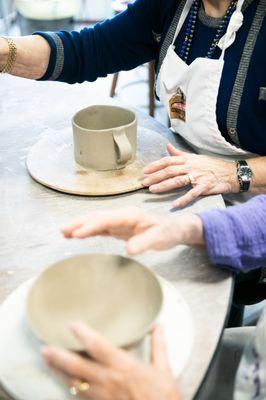 Residents making pottery in our onsite studio. Open to residents 24/7.