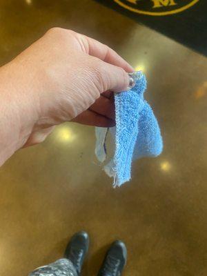 Free towel, frayed and small.