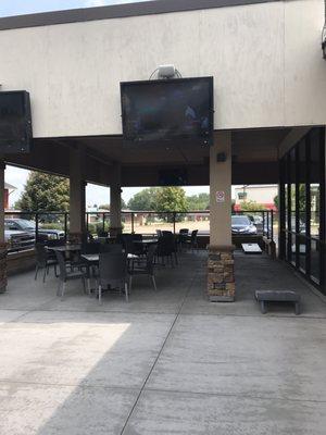 Nice outdoor patio w TVs and fireplace