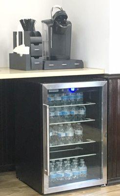 A nice little fridge for complimentary water and sodas, too bad the coffee machine wasn't being used.