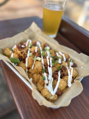 Totchos - loaded tator tot nachos loaded with bacon, cheese, sour cream, and chives.

Late night menu exclusive!