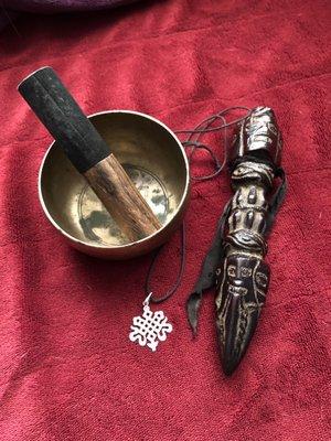 Heart Chakra Singing Bowl, Knot of Eternity Necklace, and Phurba.