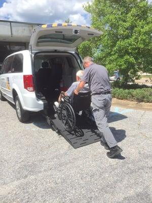 Loading my father into the Caliber van.