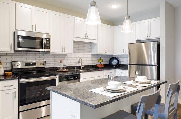 Granite countertops with stainless steel appliances.