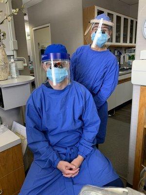 Dr. Brandon Visscher and hygienist Mary donned in PPE from head to toe!