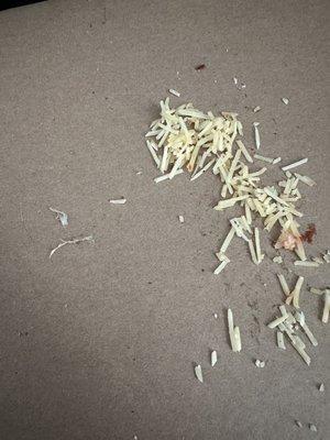 Nails to the left of Parmesan