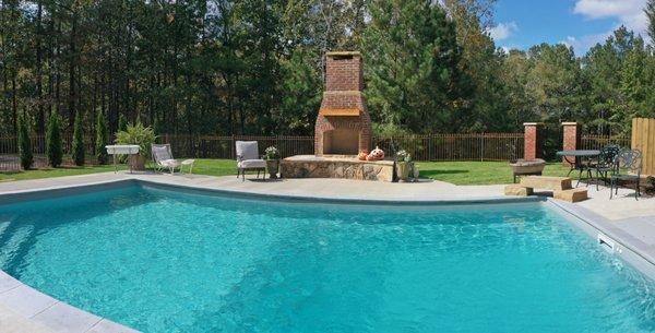 Desjoyaux pool with fireplace and firepit