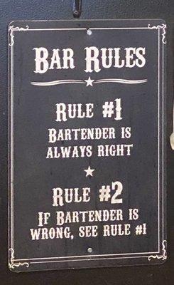 Signage Behind Bar