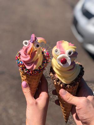 Swirl strawberry and pineapple Dole whip with sprinkles and toffee cones