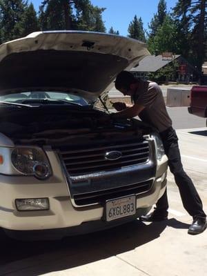 This is Ryan Haffey, store manager, sweating it out installing our battery. This guy is a champ!