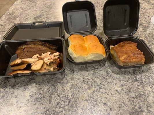 Chicken  & Brisket, dinner rolls, and peach cobbler