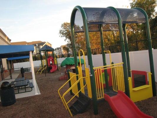 5000 sq ft outdoor playground with security fencing