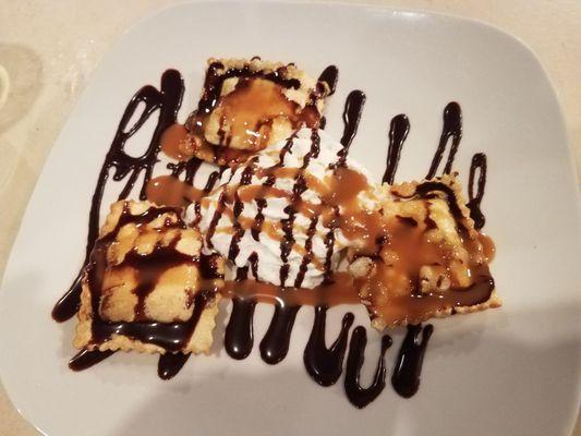 Fried chocolate ravioli with whipped cream covered with caramel and chocolate drizzel. Boom! Abd it was all gone. Ooey gooey.