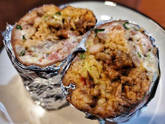 Super burrito (wheat tortilla) with Carne asada ($13.45)