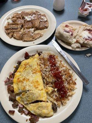 3-meat & Cheese omelet, hash browns, Dove's Dove's Huge Biscuit and pancake for sharing.  Delicious!