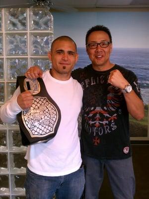 With Fernando Gonzalez, MMA World Champion and his title belt.