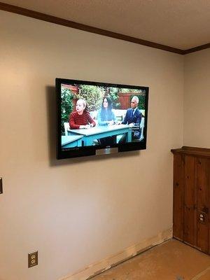 AFTER INSTALL: The tv was mounted perfectly, no damage to the newly painted wall at all.