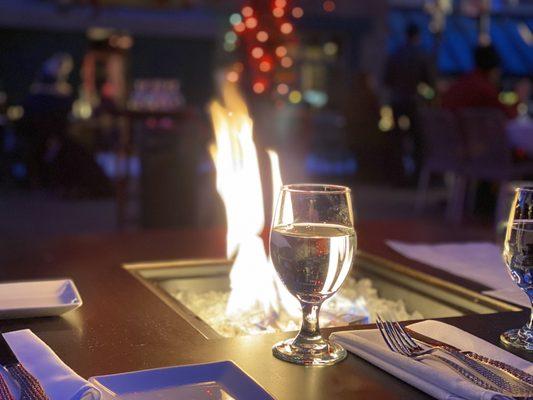 Table with fireplace on outdoor patio