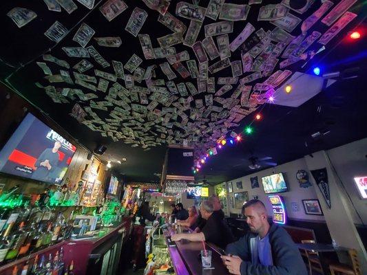 Dollar bills on the ceiling