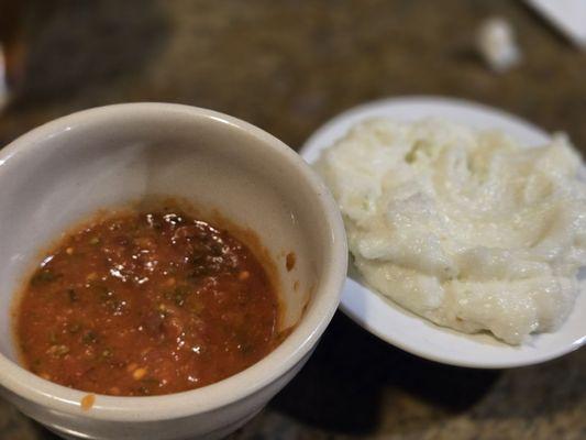 Housemade 'salsa' and garlic dip.