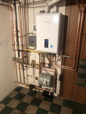 The after: 2020 Navien combi boiler does the job of both the water heater and boiler