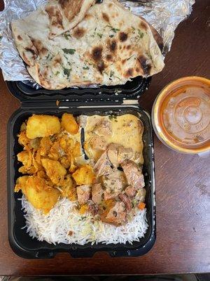 3 item combo! Potatoes and cauliflower, black pepper chicken and chicken tikka masala on the side, along with garlic naan.