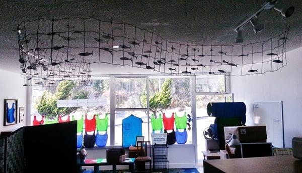 Our Office! Over our heads is an inspiring art piece made out of recycled aluminum.