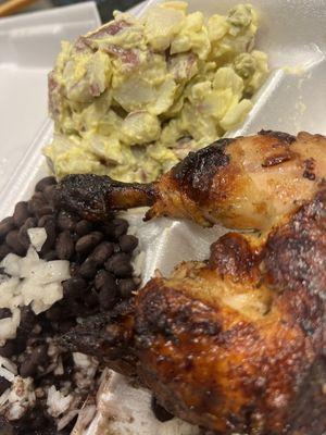 Quarter chicken with black beans and rice and potato salad