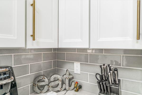 Kitchen remodel with blue cabinets,grey countertop,wooden flooring,Silver Spring