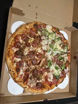 Large pizza half all the way and half meat lovers.