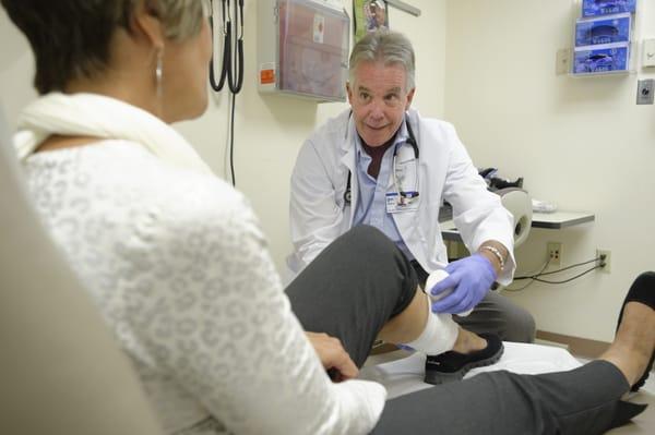 Dr. Portz, Medical Director of Beebe Wound Healing & Hyperbaric Medicine works with a patient.